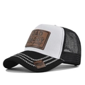 Close-up of trucker hat with DAD leather patch and breathable mesh back details - Black & White