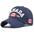 Close-up of a navy cotton baseball cap featuring 3D Canada embroidery and flag detail - Adjustable / Navy Blue