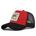 Detail view of red trucker hat featuring fish embroidery and breathable mesh back - Black and Red