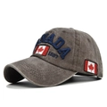 Detail view of the embroidered Canada flag and 1867 text on a washed cotton baseball cap - Adjustable / Washed Coffee