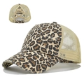 Close-up detail of leopard print trucker hat with elastic criss-cross ponytail opening - Leopard 1