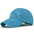 Macro view of white 3D New York embroidery and fine stitching on a sky blue cotton baseball cap - Adjustable / Blue
