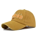 Close-up of vintage washed cotton fabric with 3D embroidery on the baseball cap - Yellow