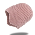 Detailed knit texture of a warm pink ponytail beanie with ear protection flaps - Pink