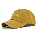 Detail view of white hair day embroidery on ginger washed cotton baseball cap - Adjustable / Yellow