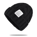 Classic black cable-knit beanie with stylish textile label and warm folded cuff design - One Size / Black