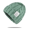 Grass green cable-knit beanie hat for winter with stylish white woven label detail - One Size / Green