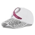 Close-up of pink rhinestone ribbon and sparkling silver gems on a white baseball cap - Adjustable / White