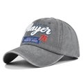 Macro detail of the Player 76 3D embroidery and washed vintage fabric texture on grey cap - Gray