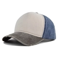 Close-up of distressed brim detail on washed vintage cotton baseball cap with color-block - Coffee