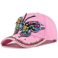 Close-up of pink baseball cap featuring a colorful rhinestone butterfly and studded brim - Adjustable / Pink (Slanted Butterfly)