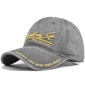 Detail of 3D embroidery on vintage grey washed cotton baseball cap with yellow text - Gray