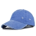 Detailed view of blue distressed baseball cap with vintage washed fabric and worn holes - Adjustable / Sky Blue