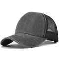 Detail view of the distressed washed cotton brim and breathable mesh of the trucker cap - Adjustable / Black