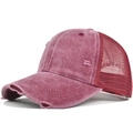 Macro detail of distressed washed fabric and breathable mesh on the vintage baseball cap - Burgundy