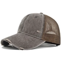 Close-up of distressed brim details on a vintage grey and brown trucker baseball hat - Coffee
