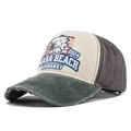 Close-up of distressed brim on vintage Omaha Beach eagle print baseball cap - Army Green