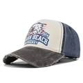 Detailed view of vintage eagle embroidery and distressed brim on the baseball cap - Coffee