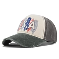 Detailed view of the distressed brim and vintage USA flag print on the baseball cap - Army Green