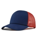 Detail view of navy blue cotton brim and red mesh back of a 5-panel trucker hat - Navy+Red