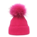 Close-up of ribbed knit texture and soft faux fur pom-pom on rose red winter beanie - M / Rose Red