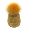 Winter fleece-lined knit beanie for women with a large faux fox fur pompom in ginger yellow - M / Yellow