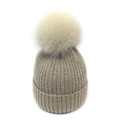 Detailed close-up of oatmeal winter knit beanie with vertical ribbed texture and fur pompom - M / Beige