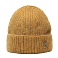 Close-up of caramel knitted beanie showing thick texture and golden metal R letter detail - M (56-58cm) / Yellow