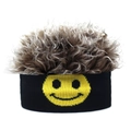 Detailed view of knitted black beanies with yellow smiley faces and curly brown wigs - Smiley Coffee