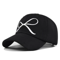 Black cotton baseball cap with white bow embroidery and curved brim for women - Black