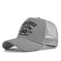 Close-up of Omaha Beach 80th anniversary print on grey mesh trucker cap with stitching - Light Gray