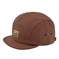 Detail view of brown five-panel camp cap featuring vintage yellow label and metal eyelets - Dark Brown