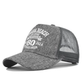 Detail showing Omaha Beach Normandy embroidery on grey mesh back trucker hat - Marl Grey