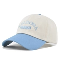 Close-up of Arizona EST 1751 embroidery on a beige and light blue baseball cap - Blue