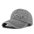 Close-up of vintage grey baseball cap featuring 3D New York embroidery and distressed details - Gray