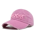 Close-up of vintage pink washed cotton baseball cap with 3D New York embroidery and distressed detail - Pink