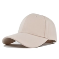 Detailed side view of beige cotton baseball cap showing twill texture and six-panel design - Beige
