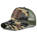Detail view of lion leather patch and breathable mesh on camouflage trucker hat - Yellow Camouflage
