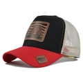 Detail of a trucker hat with a lion patch and breathable mesh back in side view - Red + Black