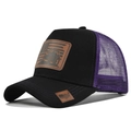 Close-up of tractor leather patch and American flag detail on black purple trucker hat - Black with Purple Mesh