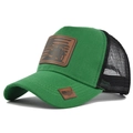 Detail of green mesh trucker hat with a vintage tractor leather patch and US flag design - Grass Green Black Mesh