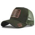 Detail view of lion leather patch on dark green mesh trucker hat with curved brim - Army Green