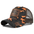 Detail of leather patch with cow design on orange camouflage mesh trucker cap - Adjustable / Orange Camouflage