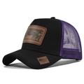 Detail of a purple mesh trucker hat with a vintage faux leather patch and American flag tag - Adjustable / Black with Purple Mesh