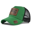 Detailed shot of green trucker hat with embroidered cow leather patch and black mesh back - Adjustable