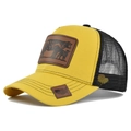 Detail of yellow trucker hat featuring a cow leather patch and mesh back design - Adjustable / Yellow Black Mesh