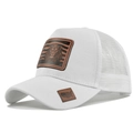 Detailed close-up of white mesh trucker hat with embossed lion head leather patch - White