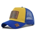 Detail of yellow and blue mesh trucker hat with tractor faux leather patch and curved brim - Blue And Yellow Mix