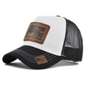 Detail of truck hat showing cow leather patch and white stitching on black brim - Adjustable / Black & White