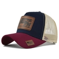 Close-up of cow pattern leather patch and US flag detail on the mesh trucker hat - Adjustable / Burgundy & Navy